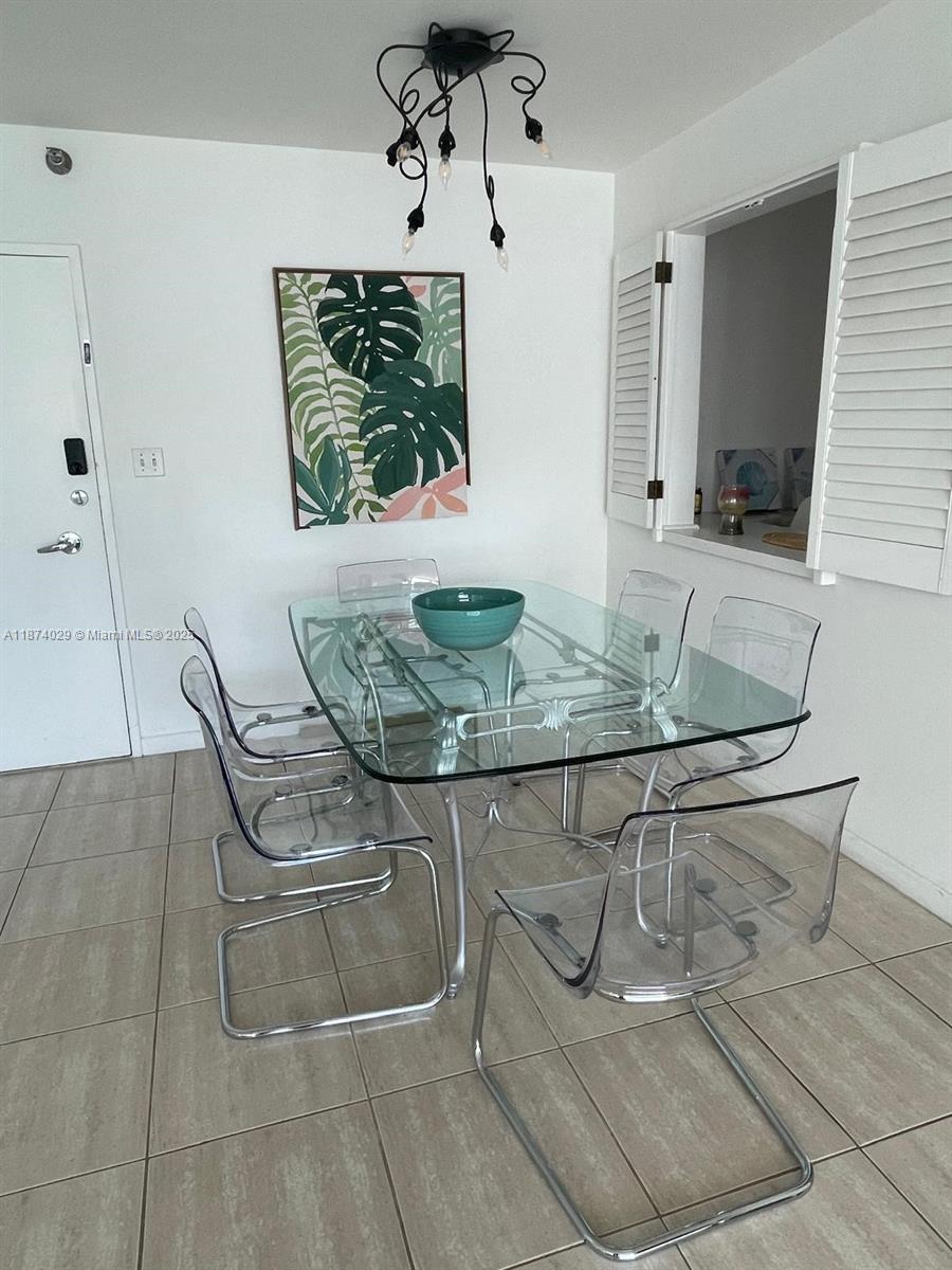 5151 Collins Avenue, Unit 1525 Miami Beach, FL 33140 - Photo 4 of 17 a view of table and chair