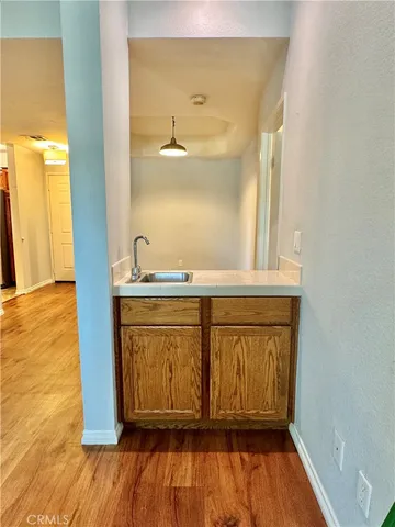 a view of front door with wooden floor