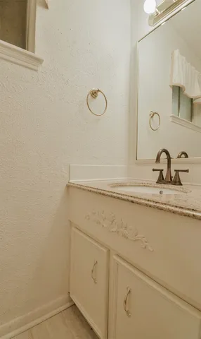 a bathroom with a sink and mirror
