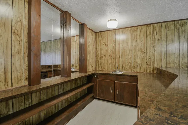 a large bathroom with a large tub and shower