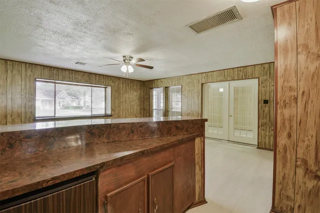 a view of a kitchen and a sink a window in a kitchen