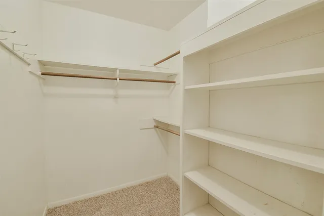 a view of an empty walk in closet