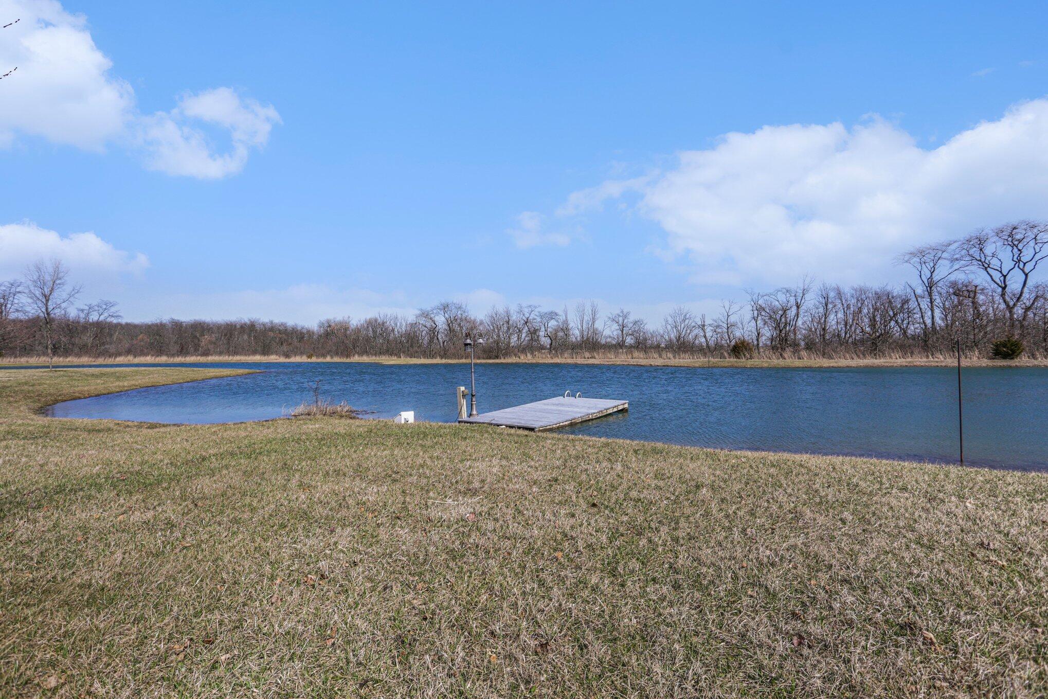 1855 Spring Valley Road London, OH 43140 - Photo 41 of 54 This aerated lake has a dock.