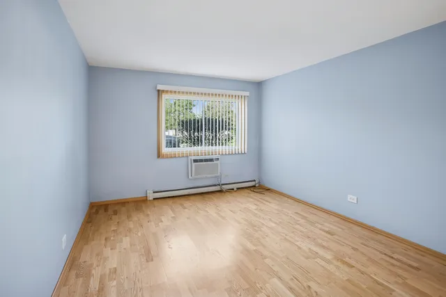 a bathroom with a granite countertop toilet a sink and shower