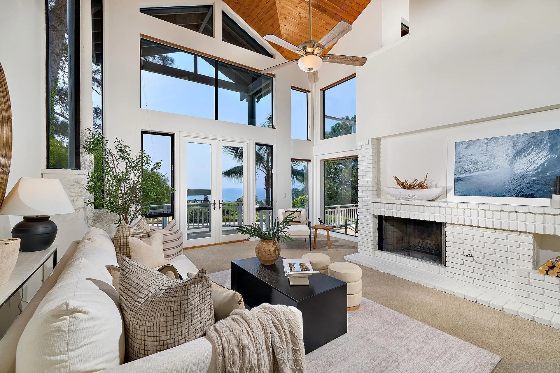 13765 Condesa Drive Del Mar, CA 92014 - Photo 31 of 75 a living room with furniture fireplace and potted plants