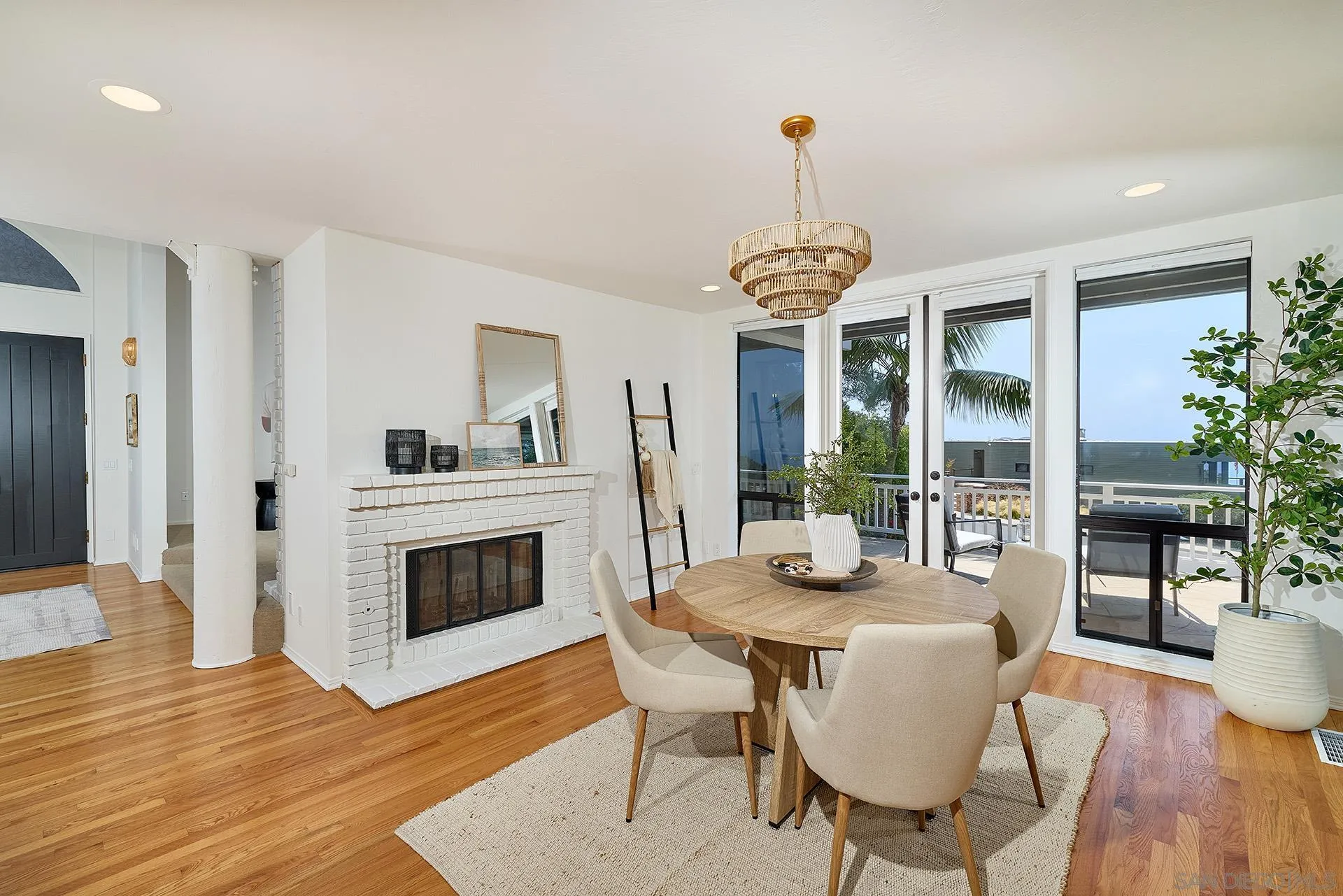 13765 Condesa Drive Del Mar, CA 92014 - Photo 35 of 75 a dining room with furniture a livingroom and chandelier