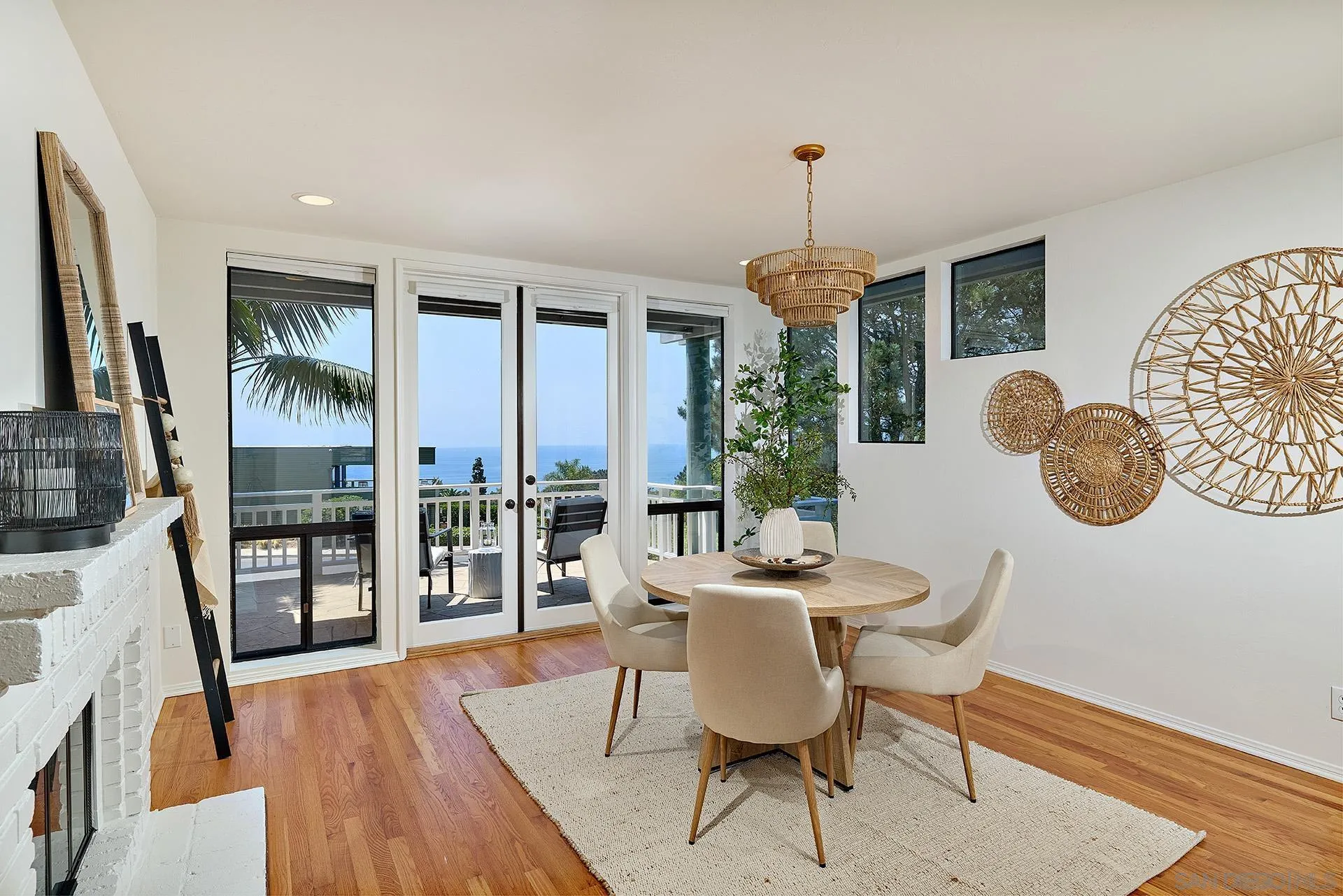 13765 Condesa Drive Del Mar, CA 92014 - Photo 37 of 75 a dining room with furniture a chandelier and wooden floor