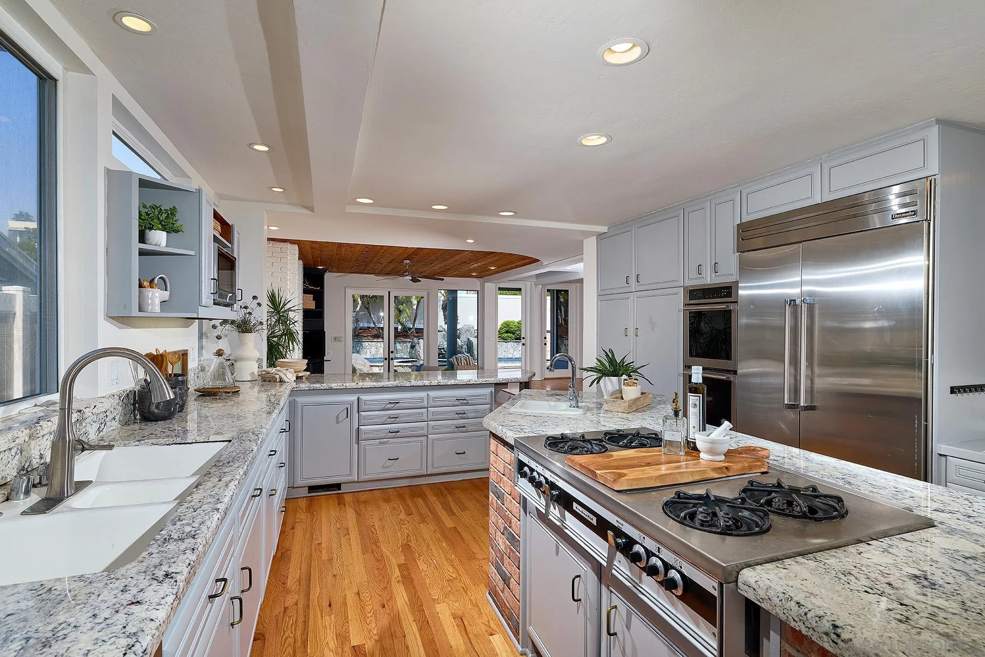 13765 Condesa Drive Del Mar, CA 92014 - Photo 40 of 75 a kitchen with a stove a sink and a refrigerator