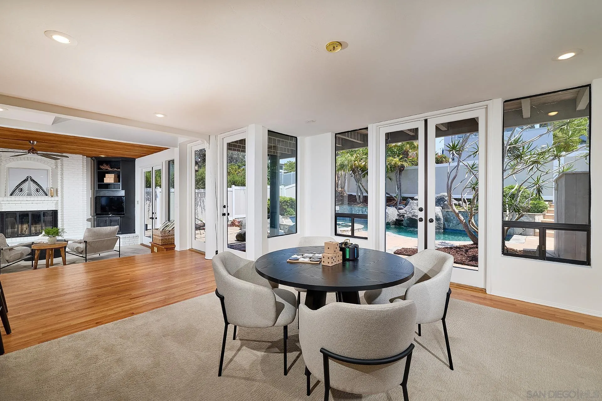 13765 Condesa Drive Del Mar, CA 92014 - Photo 44 of 75 a dining room with furniture and wooden floor