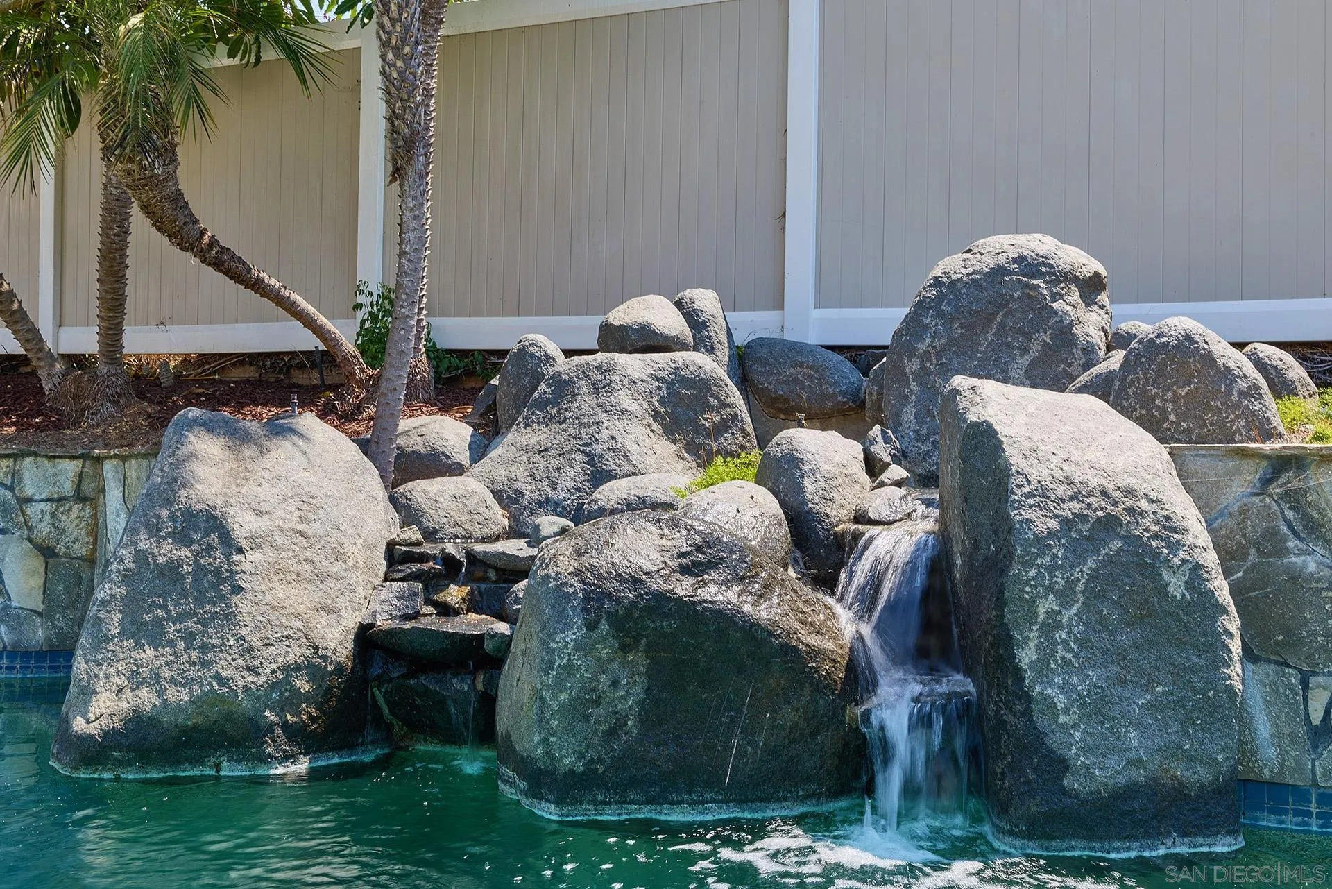 13765 Condesa Drive Del Mar, CA 92014 - Photo 52 of 75 a bed sitting in a bedroom next to a yard