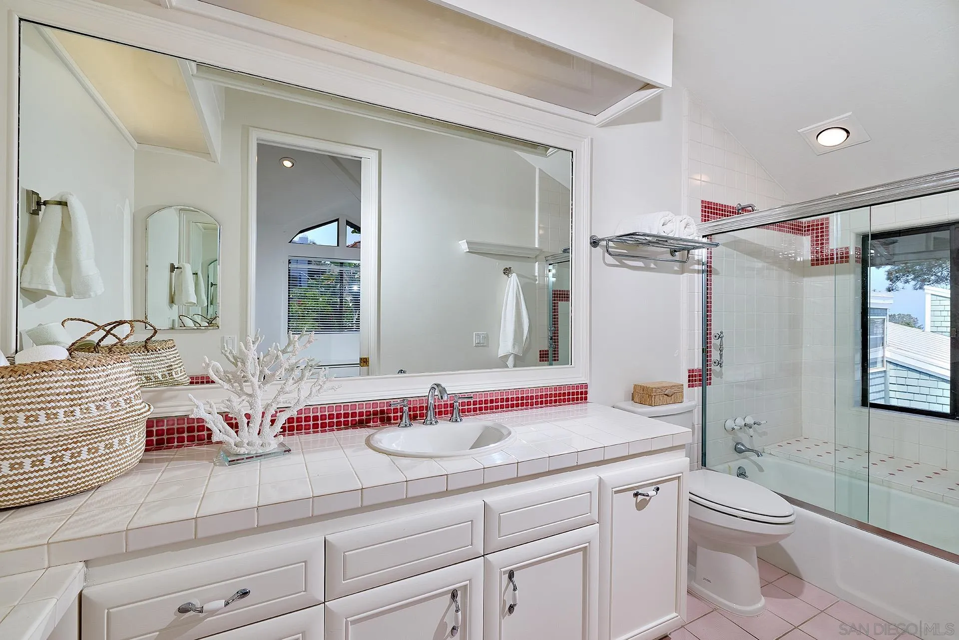 13765 Condesa Drive Del Mar, CA 92014 - Photo 68 of 75 a bathroom with a granite countertop sink mirror vanity and toilet