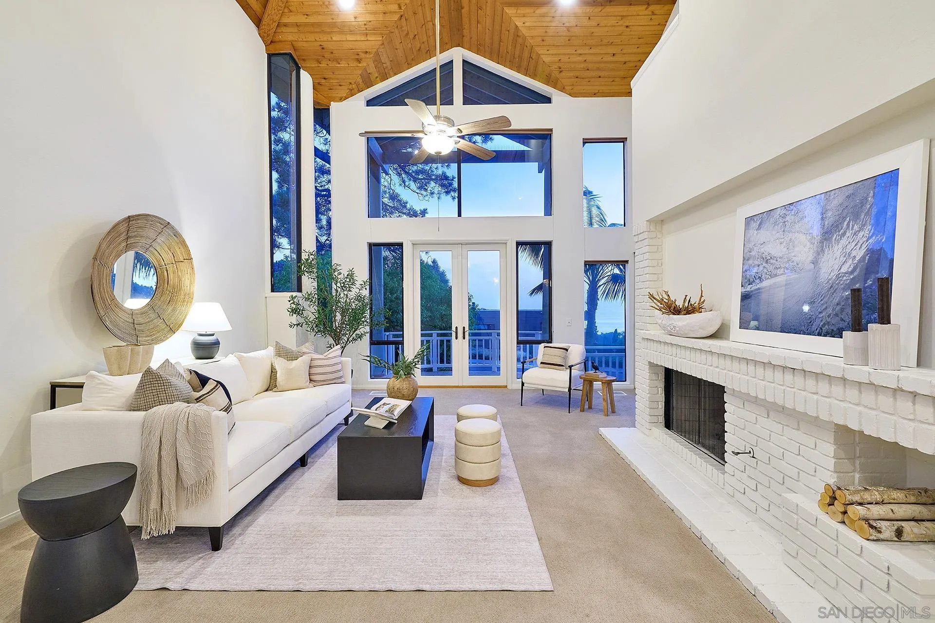 13765 Condesa Drive Del Mar, CA 92014 - Photo 8 of 75 a living room with furniture a fireplace and a chandelier