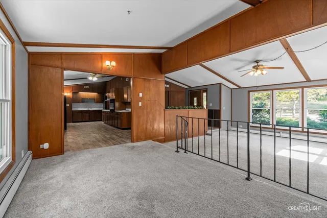 a view of a living room and a balcony