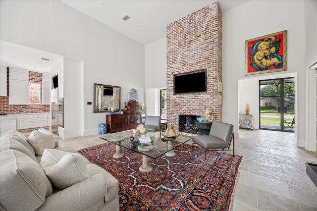 a living room with furniture fireplace and a flat screen tv