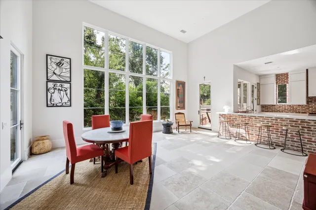 a view of a dining room with furniture window and outside view