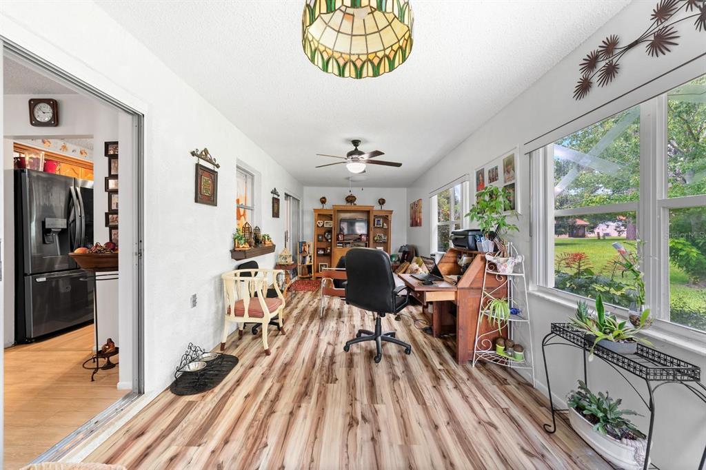 11404 Stansberry Drive Port Richey, FL 34668 - Photo 21 of 30 a view of a very nice looking room with furniture window and wooden floor