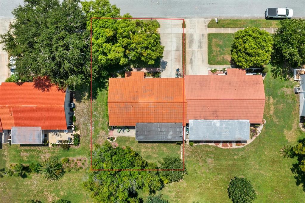 11404 Stansberry Drive Port Richey, FL 34668 - Photo 26 of 30 an aerial view of a house with a yard and large tree