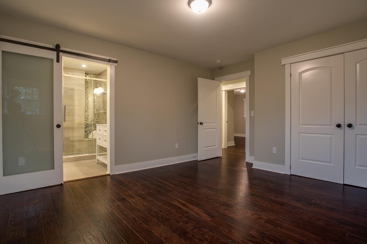 83 You Take It Road Ardmore, TN 38449 - Photo 10 of 30 an empty room with wooden floor and windows