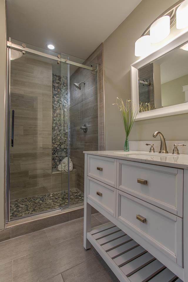 83 You Take It Road Ardmore, TN 38449 - Photo 11 of 30 a bathroom with a shower sink and mirror