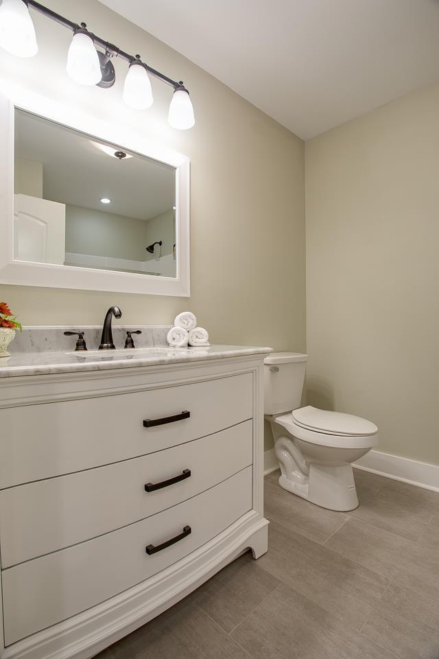 83 You Take It Road Ardmore, TN 38449 - Photo 15 of 30 a bathroom with a toilet a sink and mirror