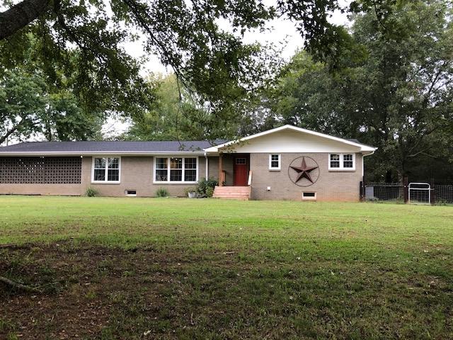 83 You Take It Road Ardmore, TN 38449 - Photo 2 of 30 a front view of a house with a yard and trees