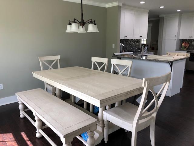83 You Take It Road Ardmore, TN 38449 - Photo 8 of 30 a kitchen with a stove a table and chairs