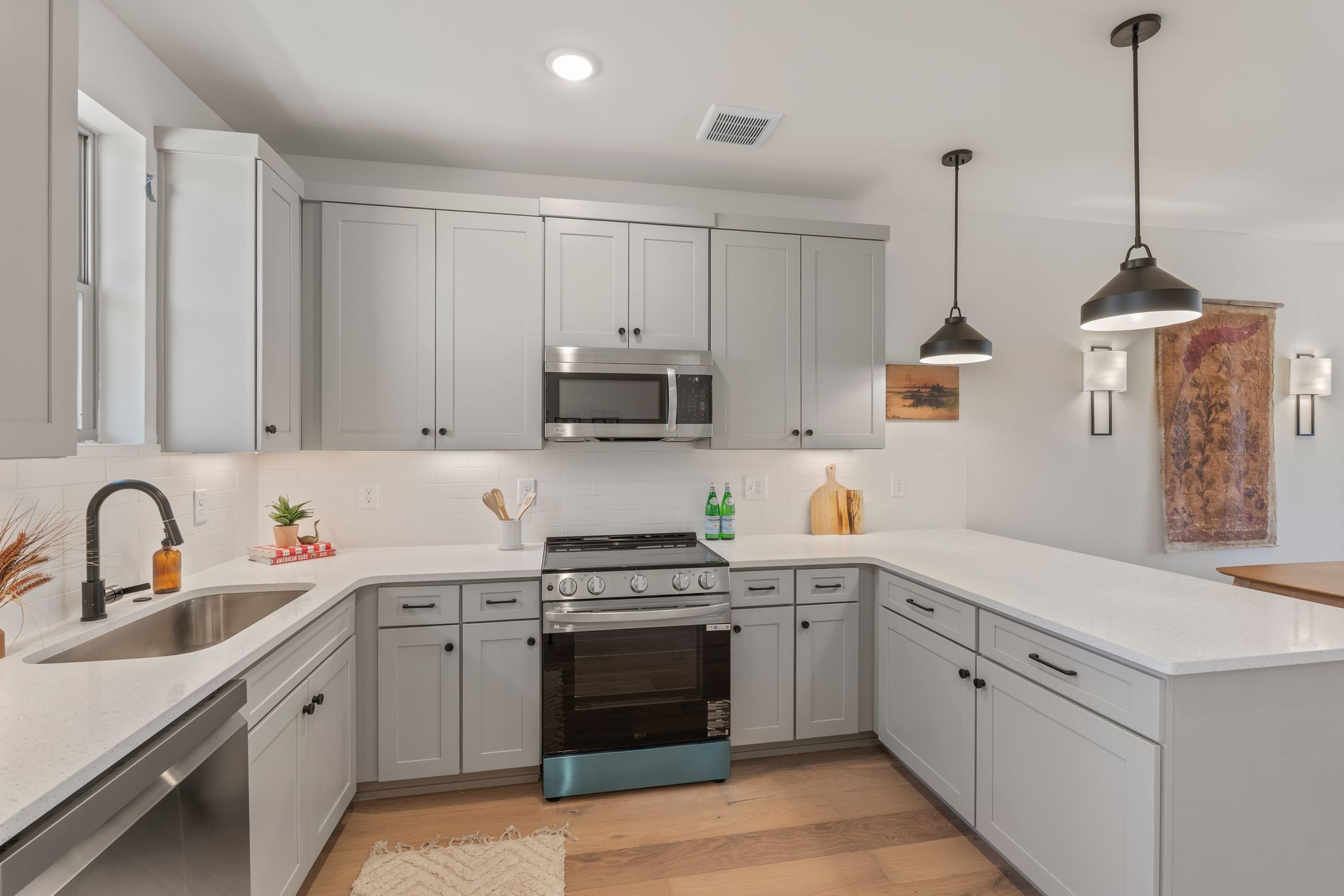 145 Whitsett Road, Unit 29 Nashville, TN 37210 - Photo 12 of 27 a kitchen with white cabinets stainless steel appliances and sink