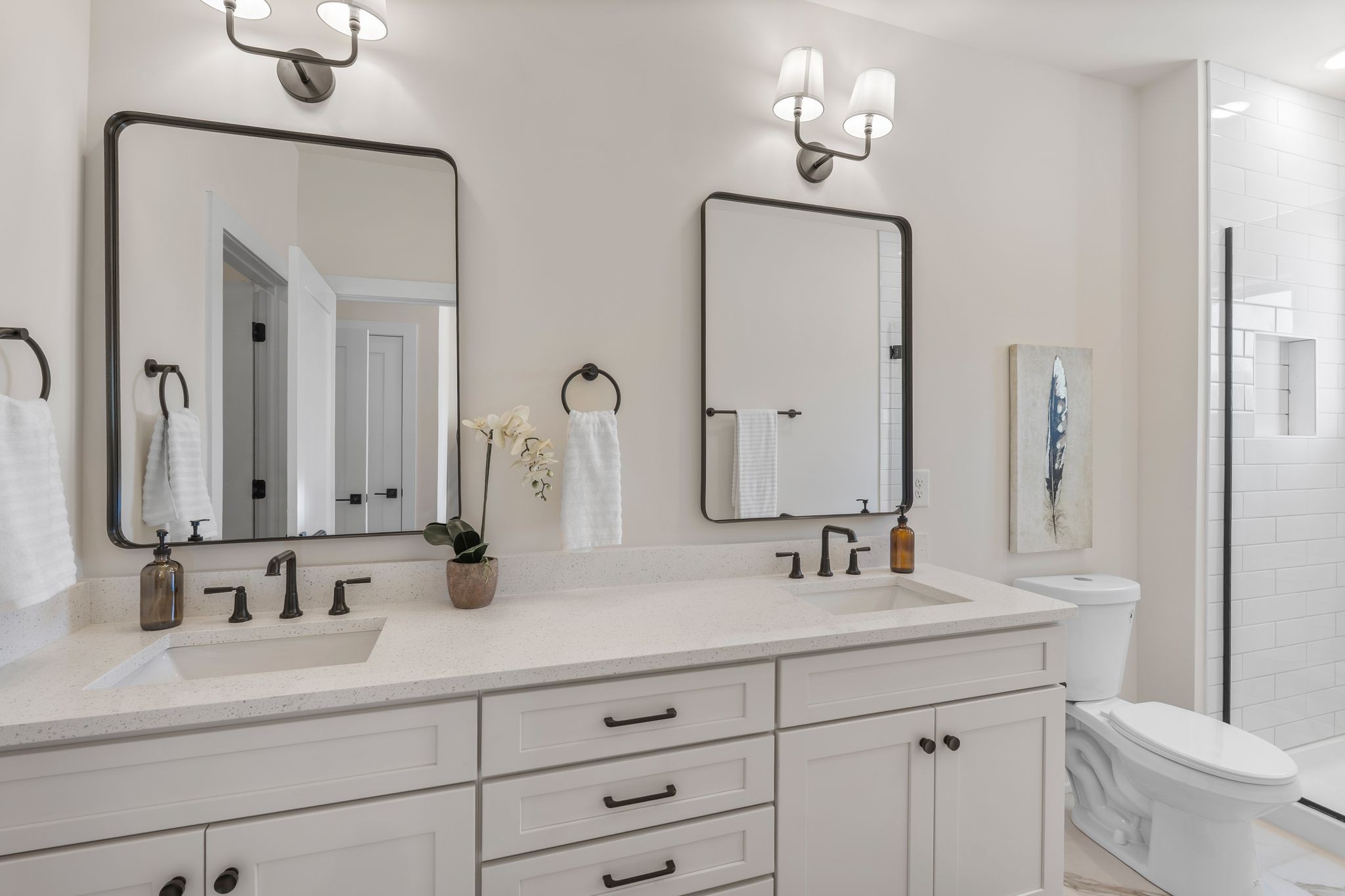 145 Whitsett Road, Unit 29 Nashville, TN 37210 - Photo 20 of 27 a bathroom with double vanity sinks and a mirror
