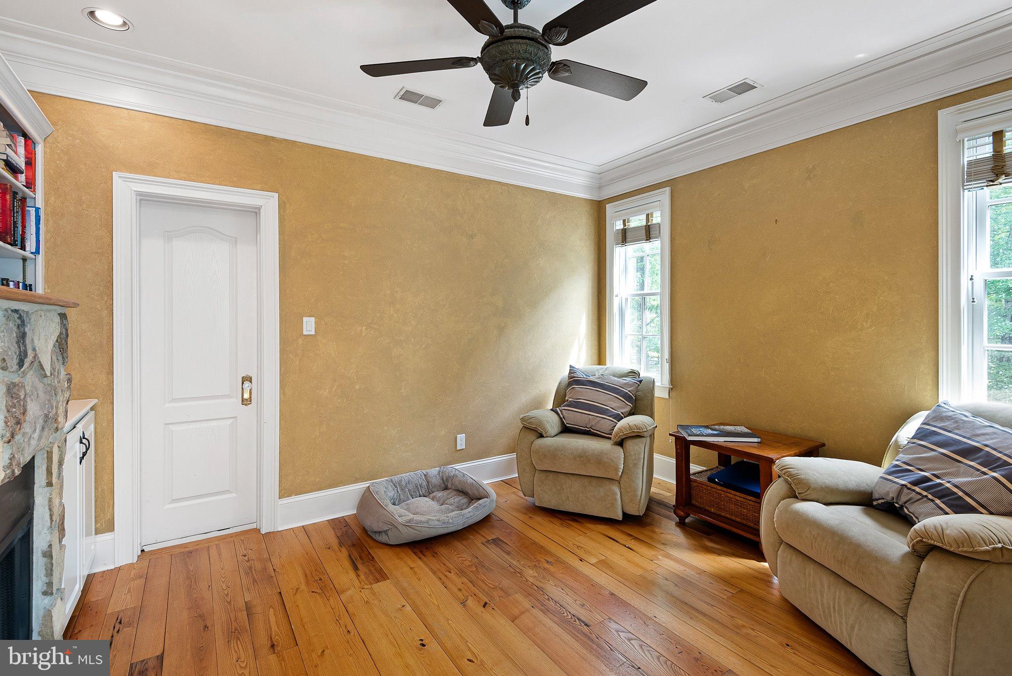 104 Timber Ridge Lane Chadds Ford, PA 19317 - Photo 32 of 65 a bedroom with furniture and a fireplace