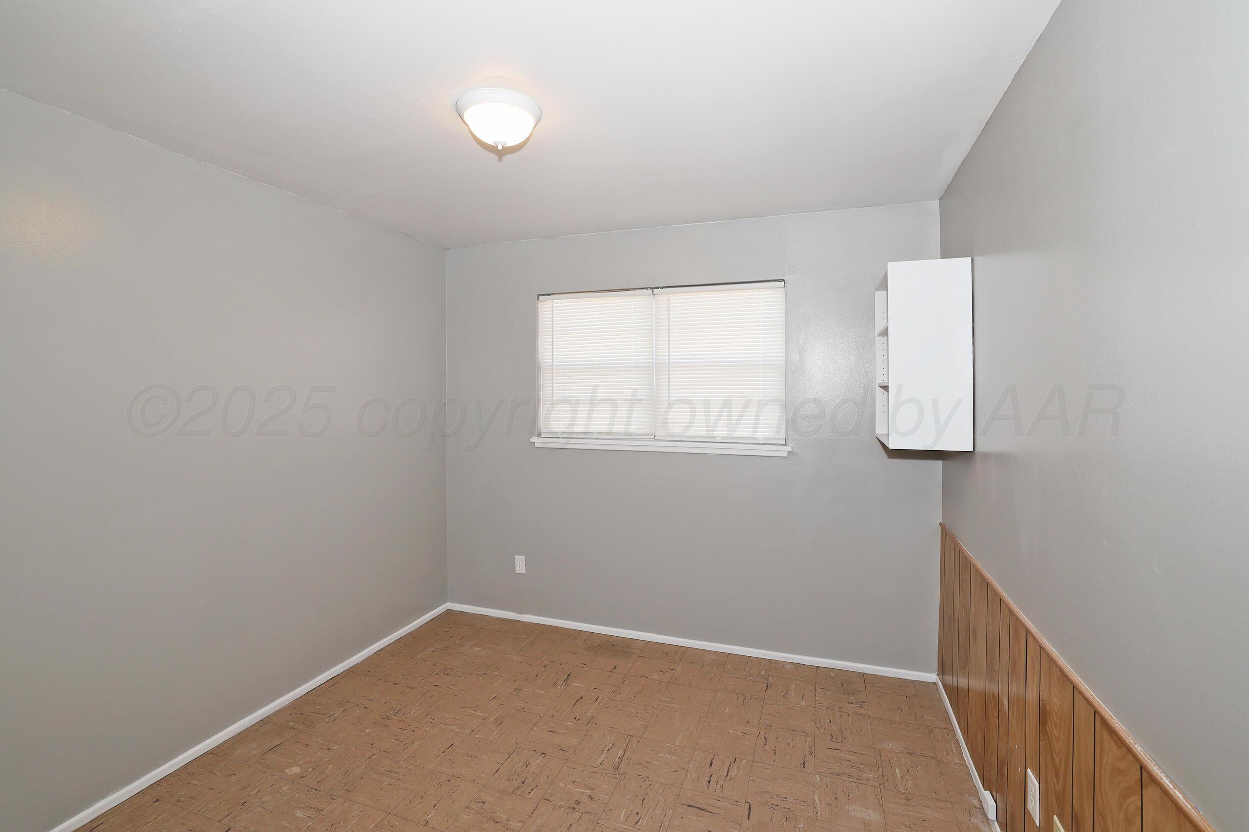 3820 Beaver Drive Amarillo, TX 79107 - Photo 16 of 24 an empty room with windows