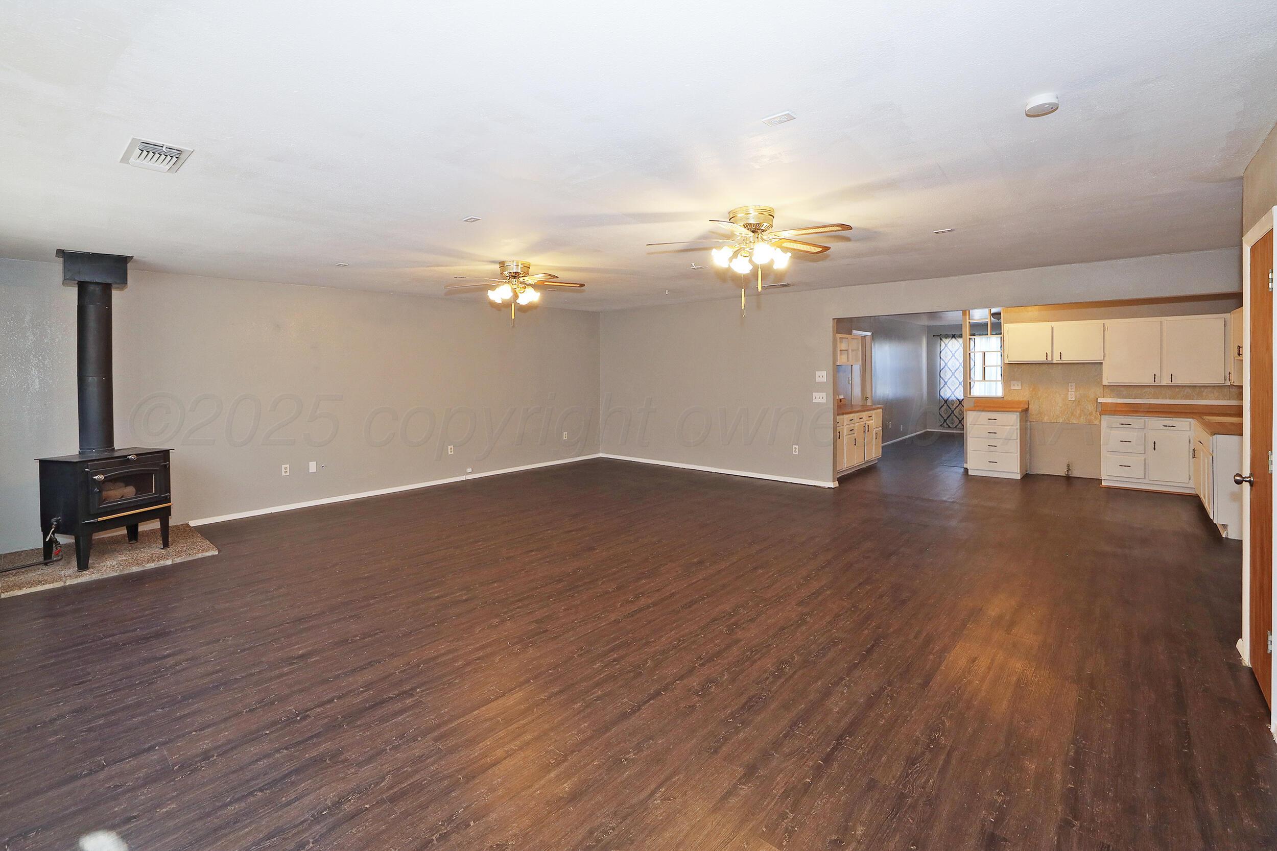 3820 Beaver Drive Amarillo, TX 79107 - Photo 3 of 24 a view of a livingroom with a hardwood floor