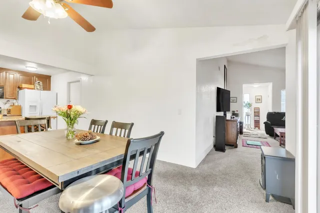a view of a dining room and livingroom with furniture