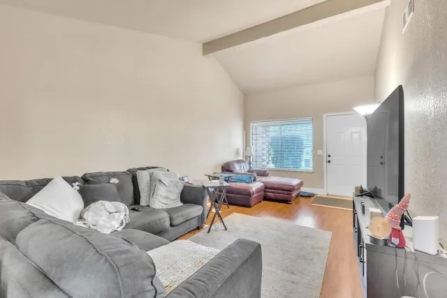 a view of a dining room with furniture and chandelier