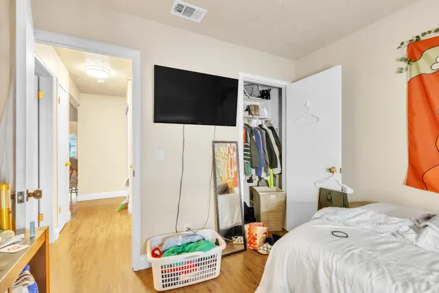 a bedroom with bed and a window