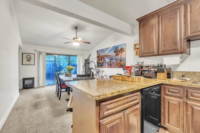 a kitchen with stainless steel appliances granite countertop a sink and cabinets