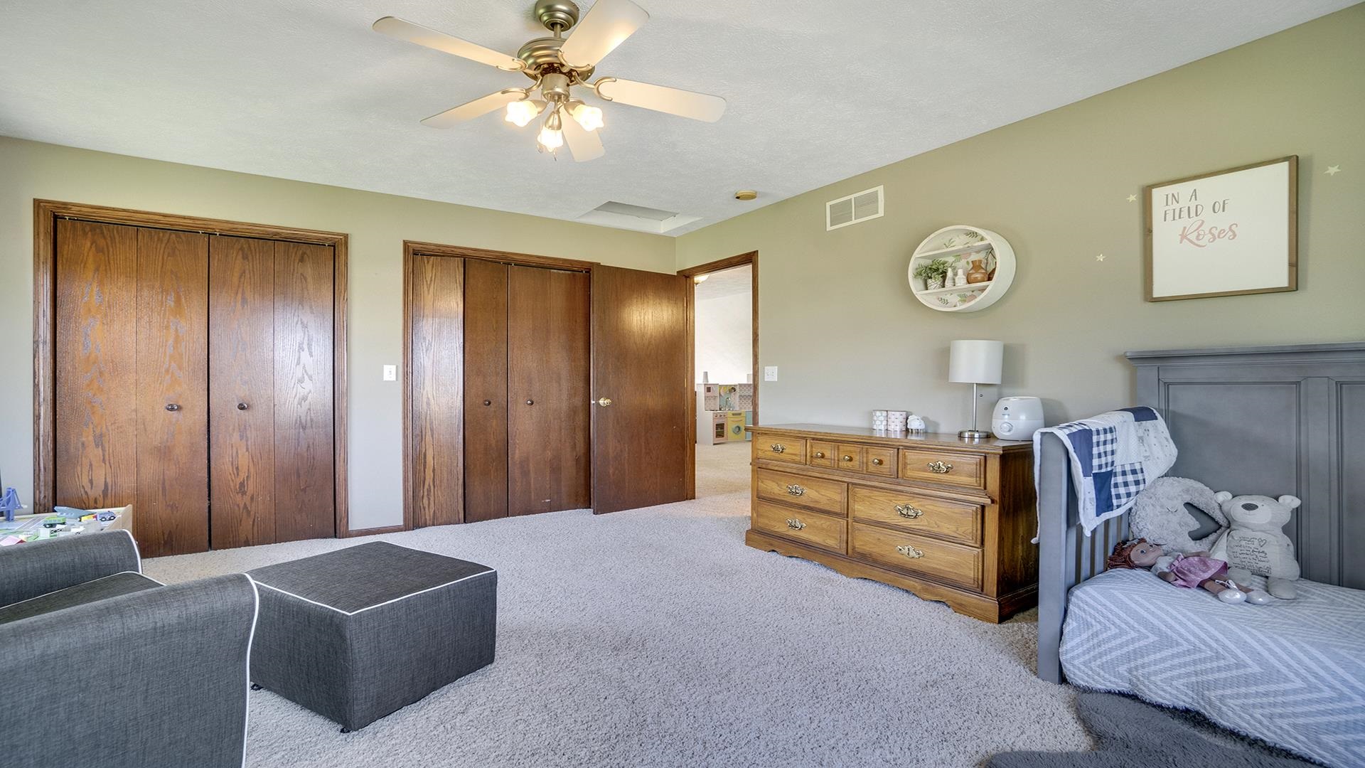 5108 North Winnebago Road Winnebago, IL 61088 - Photo 20 of 50 a bed room with a bed and a couch
