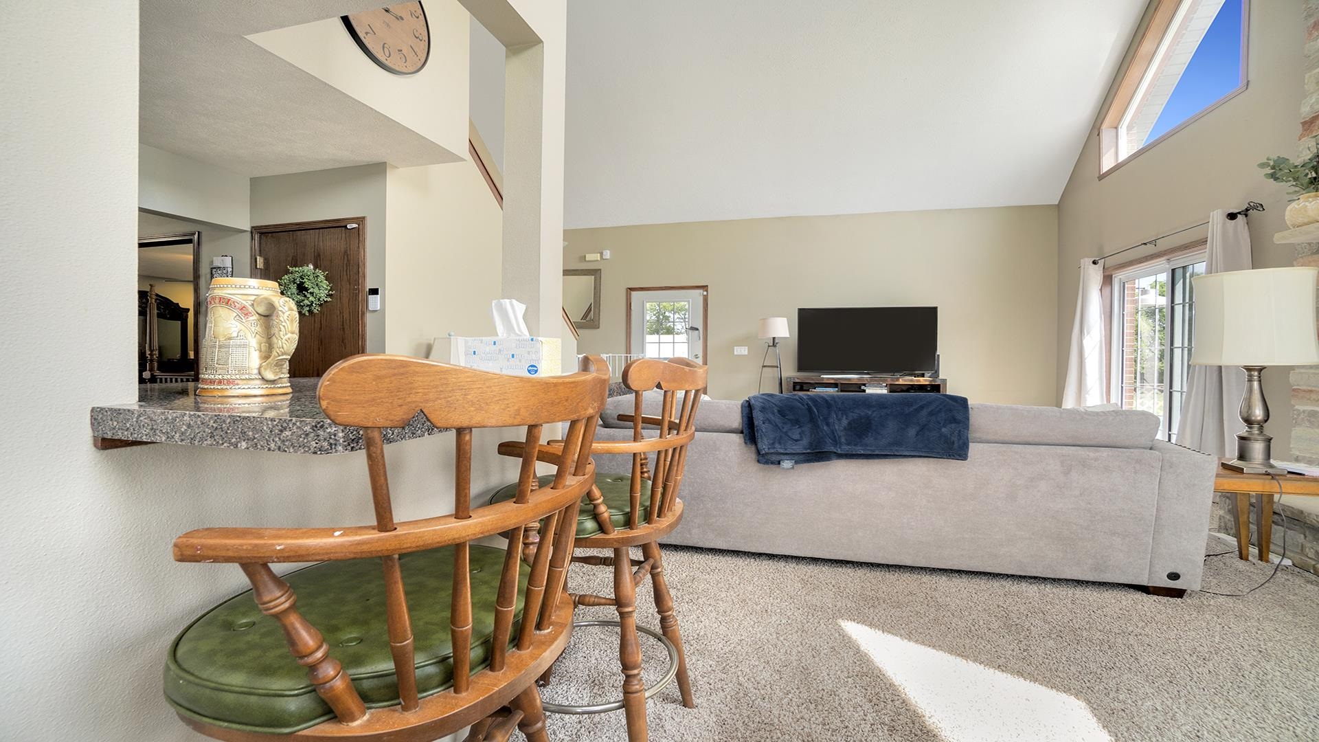 5108 North Winnebago Road Winnebago, IL 61088 - Photo 8 of 50 a living room with furniture and a flat screen tv