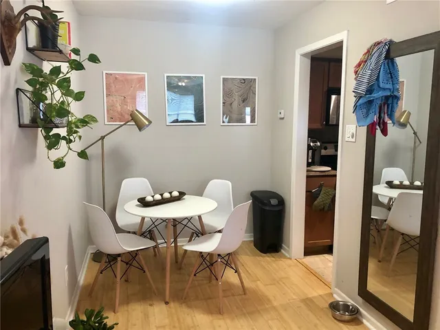 a dining room with furniture and window