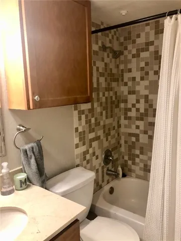 a bathroom with a bathtub and shower