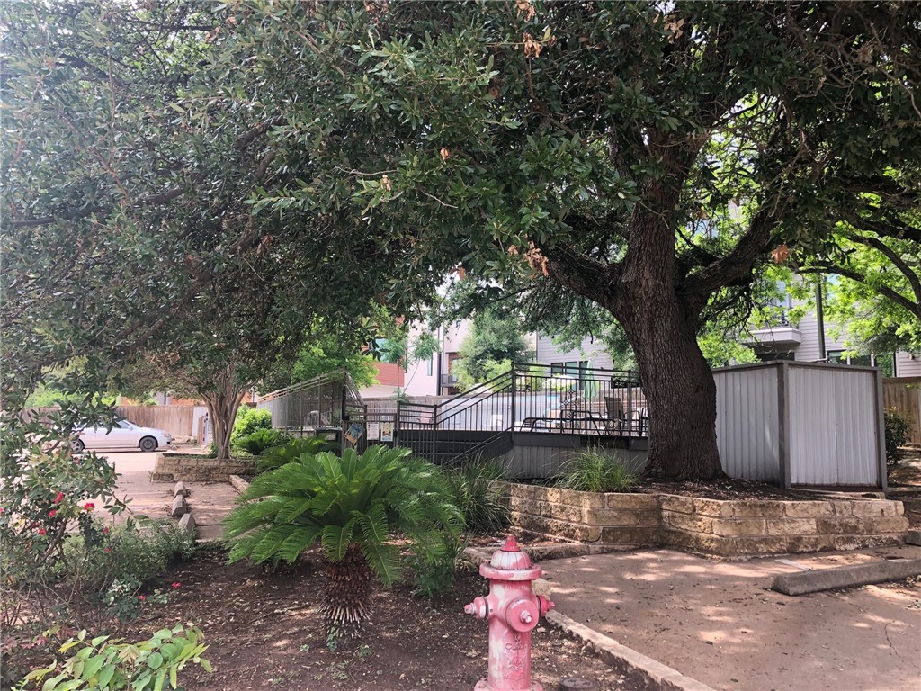 3204 Menchaca Road, Unit 315 Austin, TX 78704 - Photo 18 of 26 a view of a house with a tree and a yard
