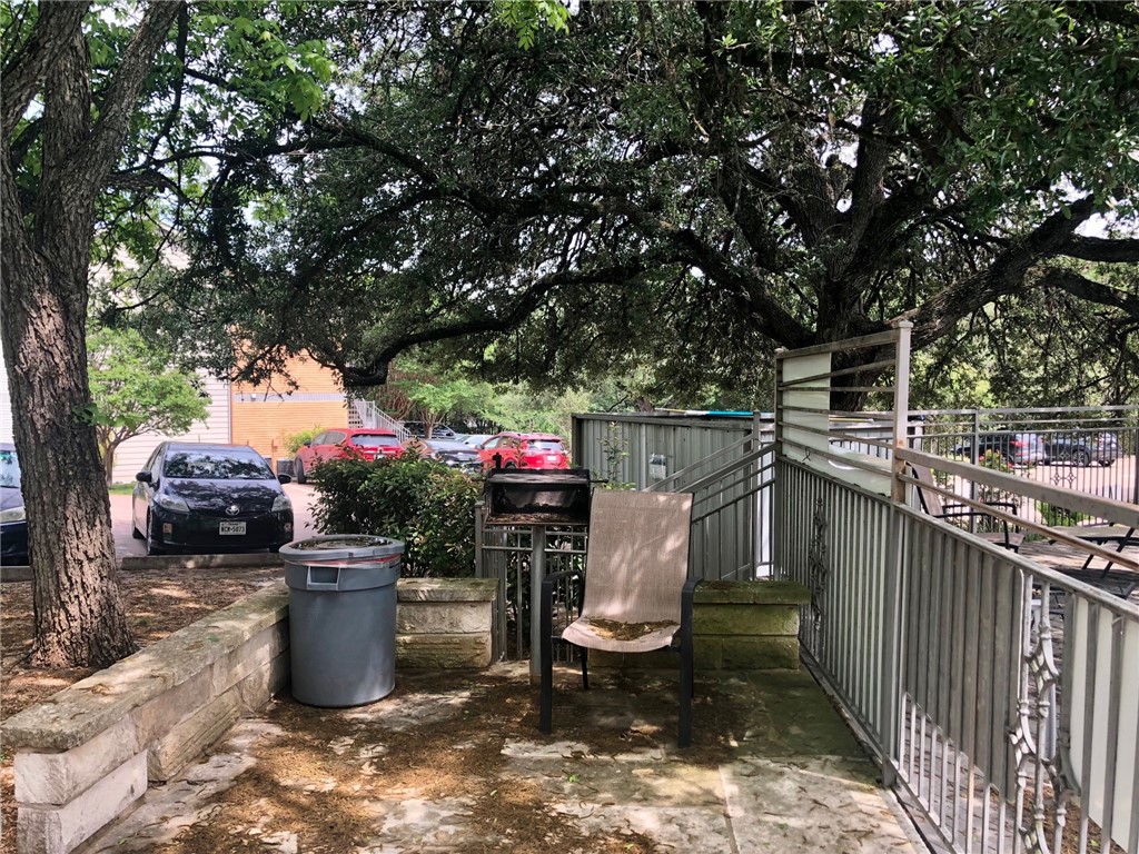 3204 Menchaca Road, Unit 315 Austin, TX 78704 - Photo 23 of 26 a utility room with stainless steel appliances a sink and a fireplace