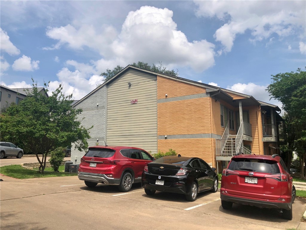 3204 Menchaca Road, Unit 315 Austin, TX 78704 - Photo 25 of 26 a car parked in front of a house