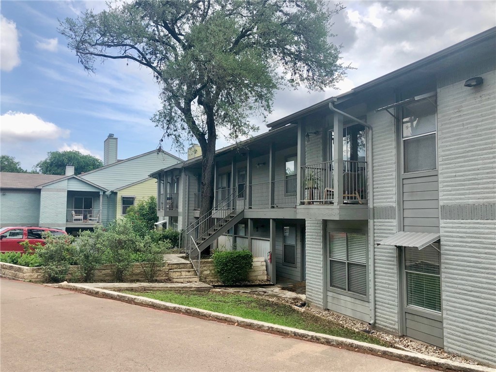 3204 Menchaca Road, Unit 315 Austin, TX 78704 - Photo 26 of 26 a front view of a house with plants and garage