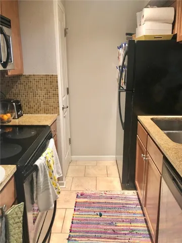 a bathroom with a sink and a washing machine