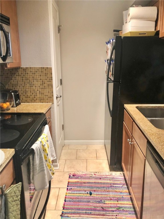3204 Menchaca Road, Unit 315 Austin, TX 78704 - Photo 4 of 26 a bathroom with a sink and a washing machine