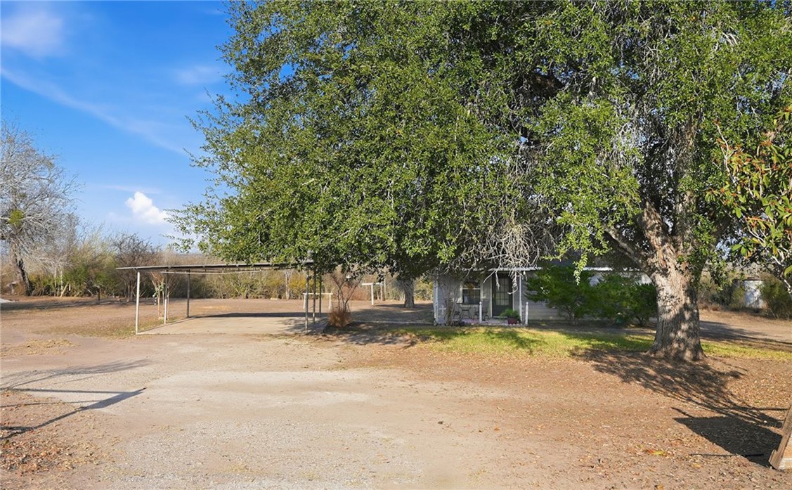 3260 Highway 281 George West, TX 78022 - Photo 20 of 34 a house with trees in front of it