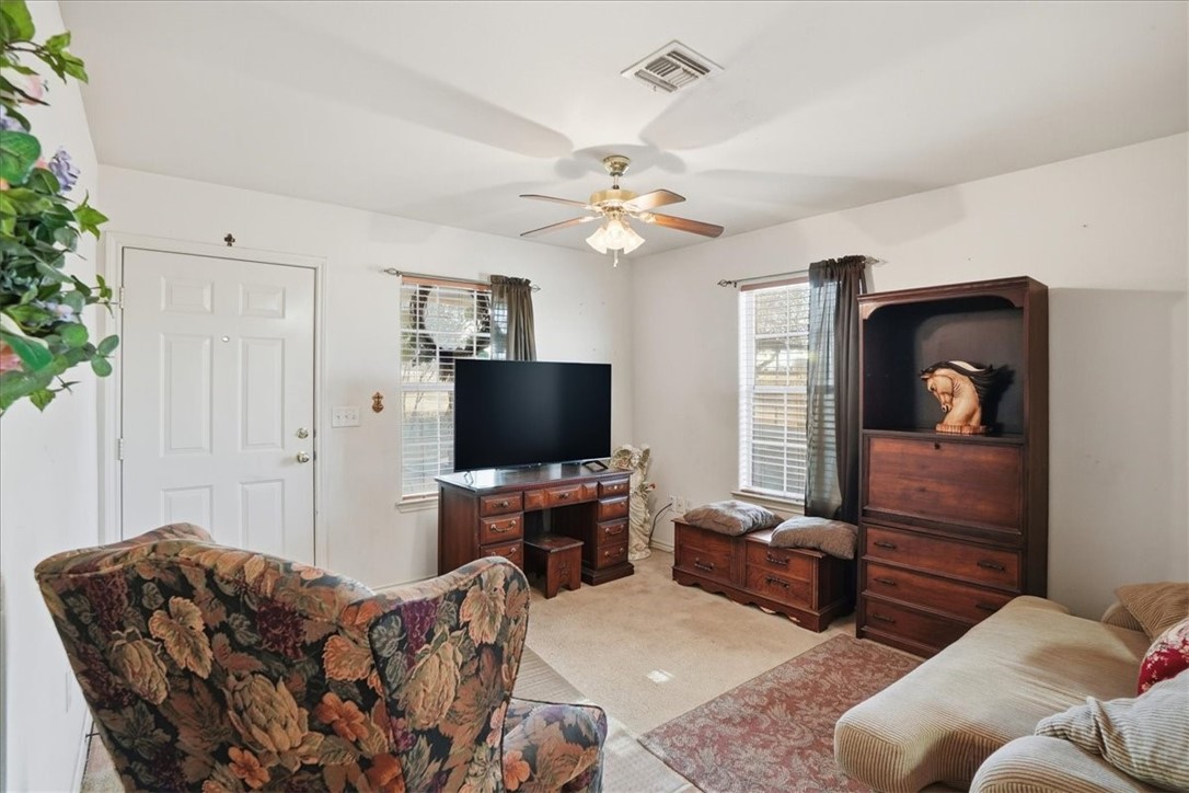 3260 Highway 281 George West, TX 78022 - Photo 2 of 34 a living room with furniture and a flat screen tv