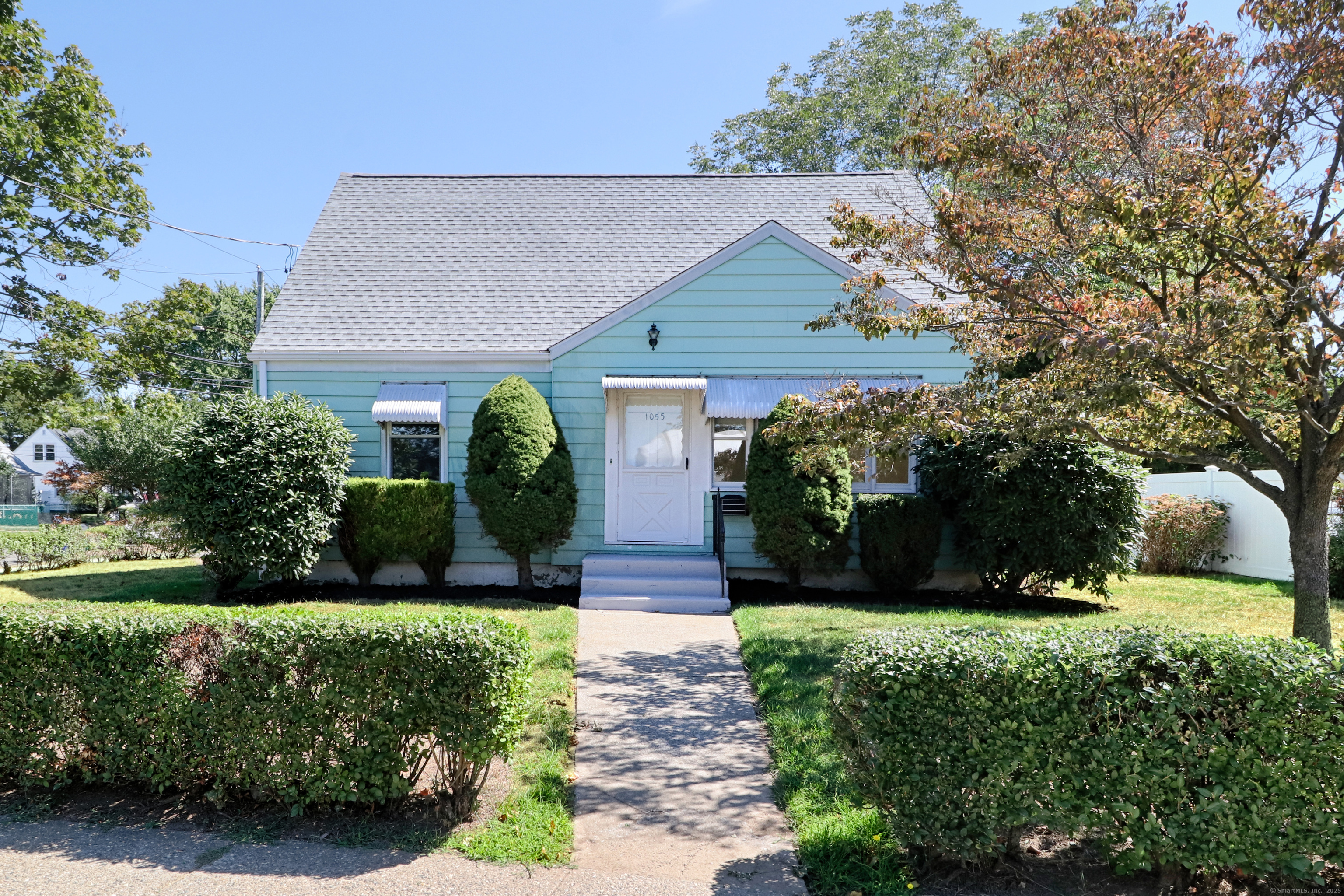 a front view of a house with garden