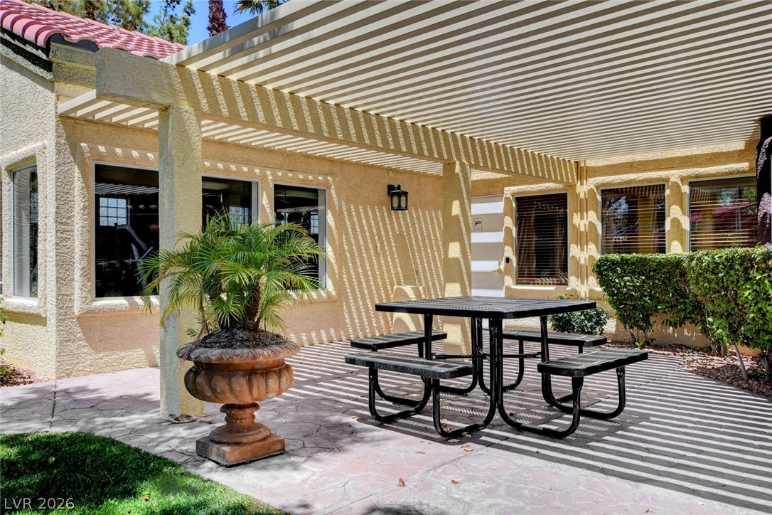 7885 West Flamingo Road, Unit 1050 Las Vegas, NV 89147 - Photo 38 of 62 A spacious patio area offers a perfect spot for outdoor dining and relaxation.