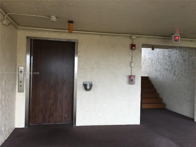 a view of a porch with wooden floor and stairs